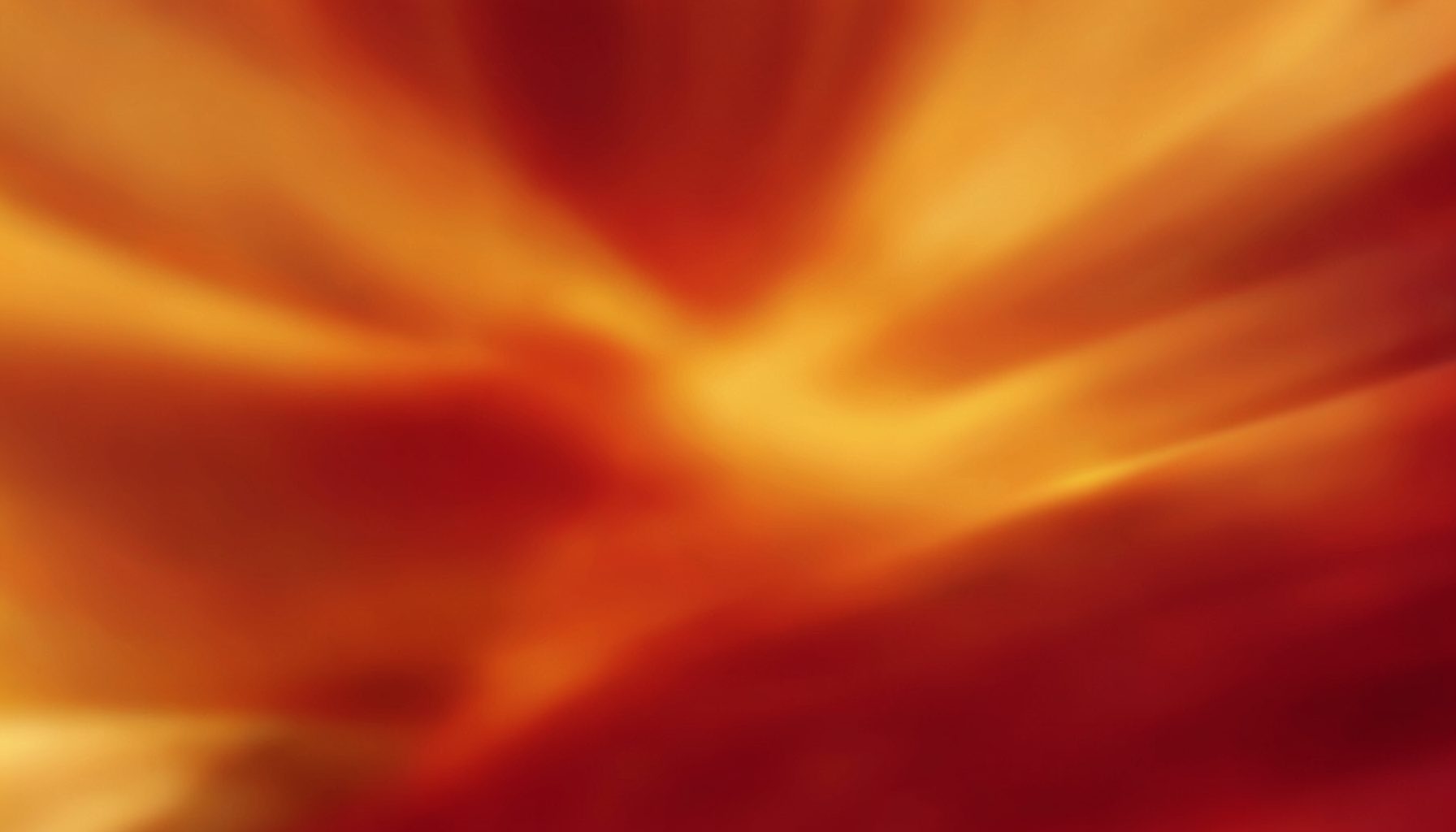 Warm amber and crimson abstract composition with soft blurred motion, evoking an animated visual style